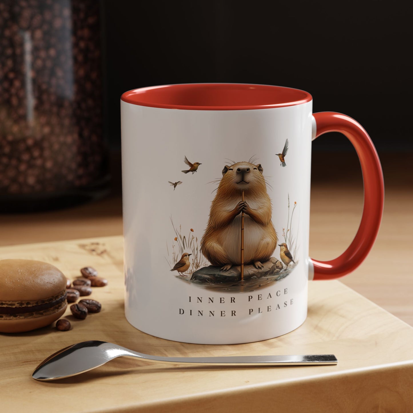 Red Inner Peace Capybara Mug. Featuring a serene capybara and the words "Inner Peace," this mug is perfect for moments of mindfulness and relaxation. Sip your favorite beverage and embrace tranquility with every sip.