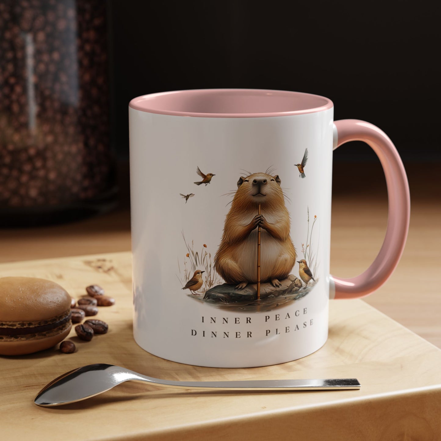 Pink Inner Peace Capybara Mug. Featuring a serene capybara and the words "Inner Peace," this mug is perfect for moments of mindfulness and relaxation. Sip your favorite beverage and embrace tranquility with every sip.
