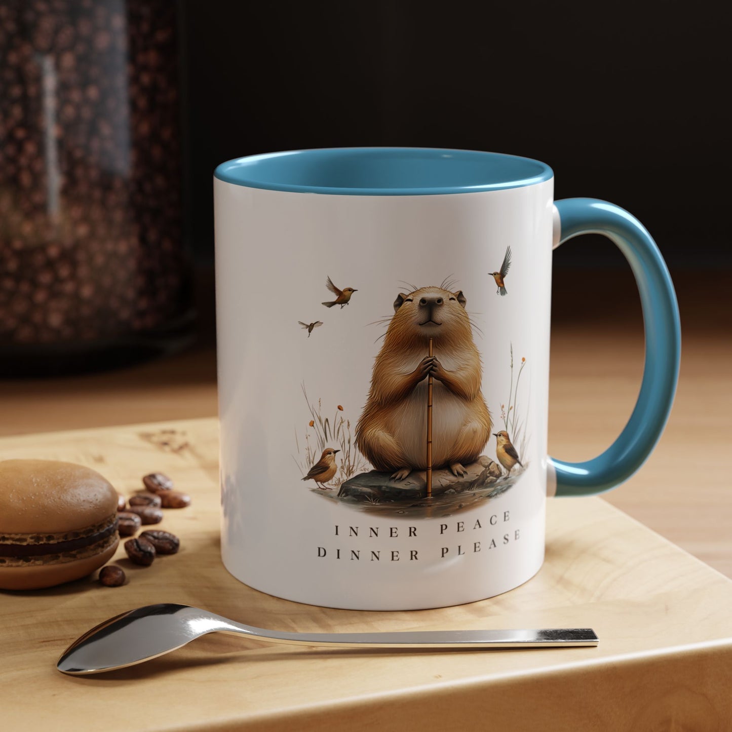 Blue Inner Peace Capybara Mug. Featuring a serene capybara and the words "Inner Peace," this mug is perfect for moments of mindfulness and relaxation. Sip your favorite beverage and embrace tranquility with every sip.