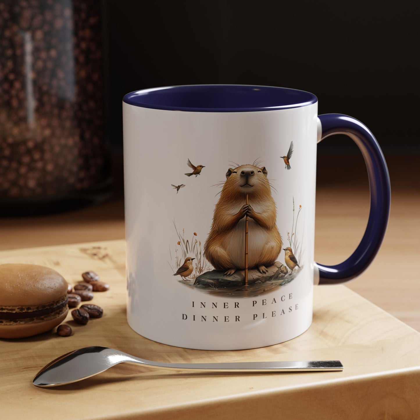 Navy Inner Peace Capybara Mug. Featuring a serene capybara and the words "Inner Peace," this mug is perfect for moments of mindfulness and relaxation. Sip your favorite beverage and embrace tranquility with every sip.