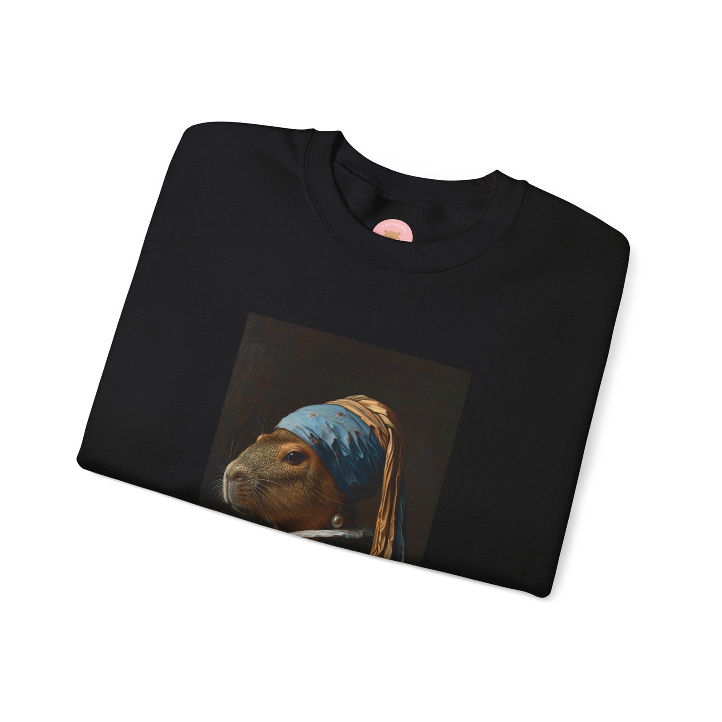 Capy de Vermeer Capybara sweatshirt features a painting inspired by VERMEER's famous painting - A Girl With A Pearl Earring. It's a fun twist for capybara lovers and art enthusiasts, giving off a whimsical and artistic vibe. Perfect for those who appreciate unique and creative designs, this sweatshirt is relevant for art lovers, animal enthusiasts, and those looking for a quirky addition to their wardrobe. Ideal for gifting during birthdays, Christmas, or any special occasion.