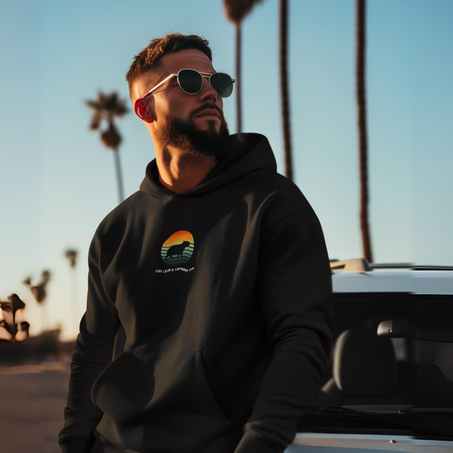 Fall fashion, Sunset Stay Calm Capybara Hoodie, Cool Sunset Animal Lover Sweatshirt, Nature Graphic Pullover, Unique Capybara Gift, Comfy Hoodie.Featuring a capybara against a cool sunset backdrop. Made using 100% US cotton. Super comfy. Unisex cut.