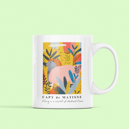 Capybara ceramic mug featuring a painting inspired by artist Henri Matisse, with a hidden capybara. Perfect for art lovers and capybara enthusiasts, creating a vibe of abstract chaos. Ideal for cozy mornings or artistic tea breaks. Relevant for art enthusiasts, animal lovers, and those who appreciate unique designs. Perfect for gifting on birthdays, Christmas, or as a thank you present.