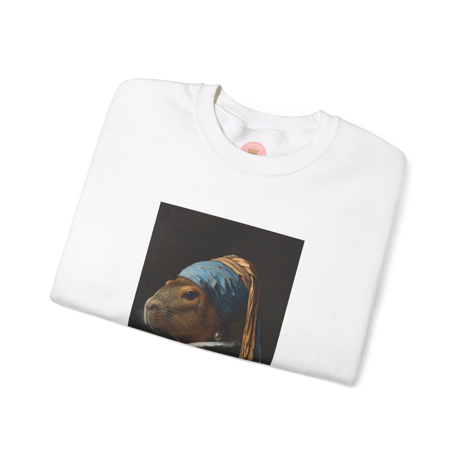 Capy de Vermeer Capybara sweatshirt features a painting inspired by VERMEER's famous painting - A Girl With A Pearl Earring. It's a fun twist for capybara lovers and art enthusiasts, giving off a whimsical and artistic vibe. Perfect for those who appreciate unique and creative designs, this sweatshirt is relevant for art lovers, animal enthusiasts, and those looking for a quirky addition to their wardrobe. Ideal for gifting during birthdays, Christmas, or any special occasion.