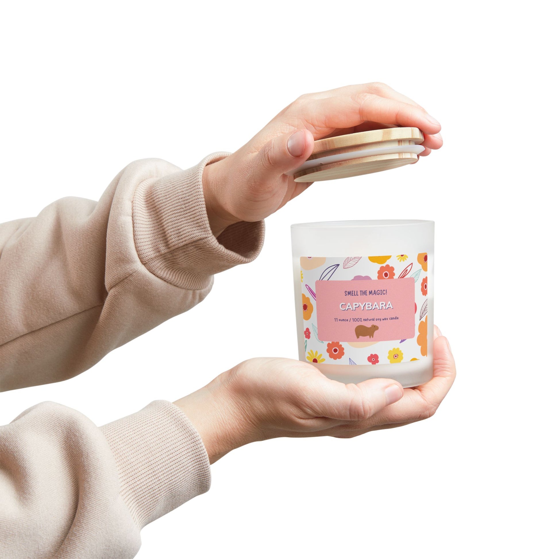 Capybara Gift 11oz Frost Candle, featuring a funny label featuring a cute capybara and a flowery background. It has an unique wooden wick that crackles gently as it burns. This exquisite candle is more than just a light source—it's an elegant piece of decor