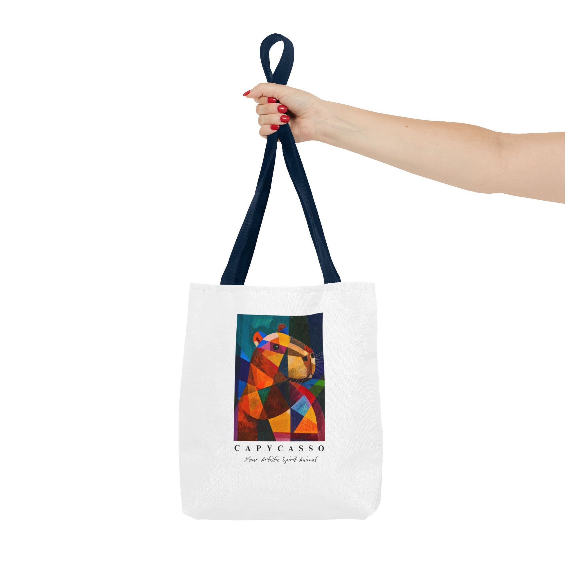 Capybara tote bag featuring a painting inspired by Pablo Picasso, with abstract forms and geometric shapes. 5 handle colours. Perfect for art lovers and capybara enthusiasts, this tote bag adds a touch of artistic flair to your everyday errands. Great for carrying books, groceries, or daily essentials. Ideal for art enthusiasts, animal lovers, and those looking to add a pop of creativity to their style. Perfect for gifting on birthdays, holidays, or as a treat for yourself.