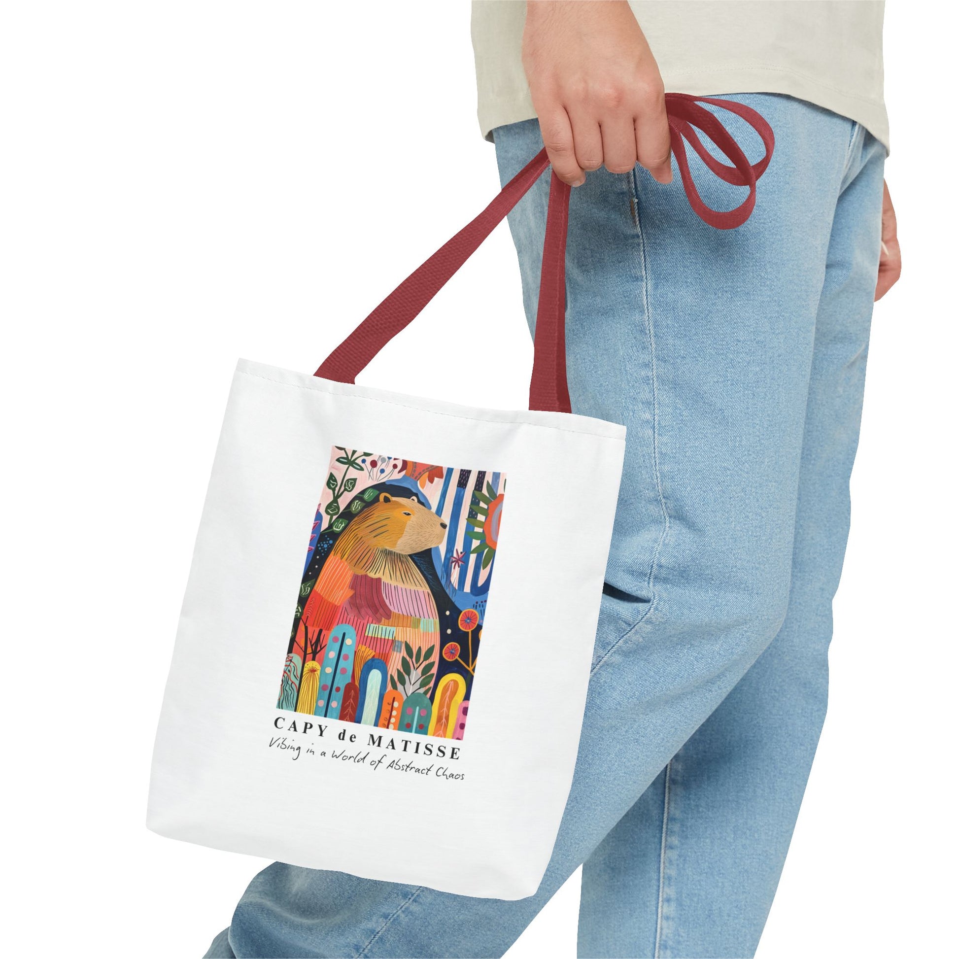 Capybara 13"x13" tote bag featuring a graphic of a painting inspired by artist Henri Matisse, with a hidden capybara. Perfect for art lovers and capybara enthusiasts, this tote bag adds a touch of artistic flair to your everyday errands. Great for carrying books, groceries, or daily essentials. Ideal for art enthusiasts, animal lovers, and those looking to add a pop of creativity to their style. Perfect for gifting on birthdays, holidays, or as a treat for yourself.