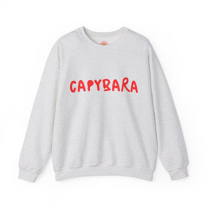 Capybara crewneck sweatshirt features the playful plain text design of CAPYBARA. It offers a comfy wearing experience with a classic fit and crew neckline. Perfect for colder months, this sweatshirt is ideal for those who love unique and chill designs. The target audience includes individuals who enjoy cozy apparel with a touch of personality. Relevant for holidays, casual gatherings, and everyday wear.