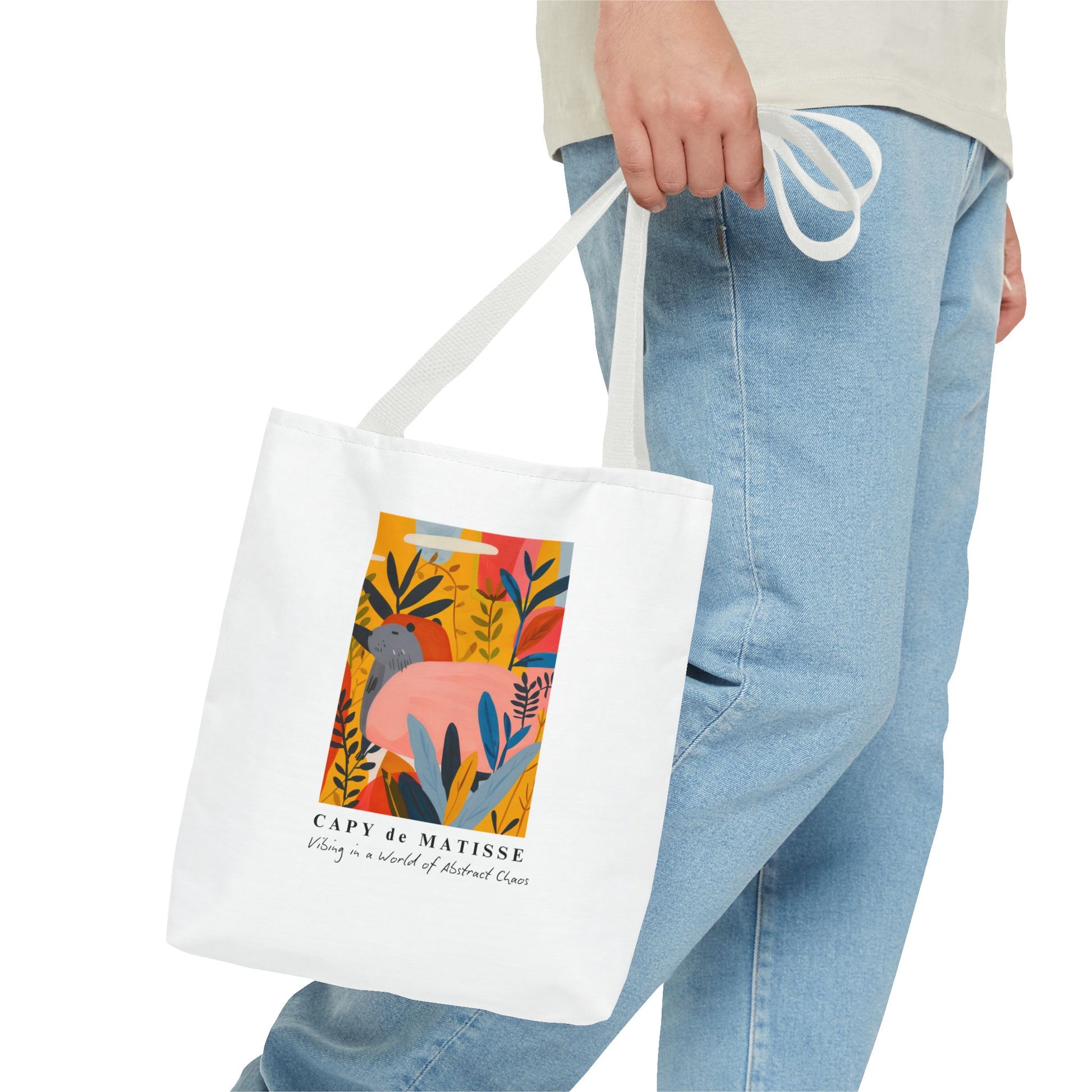 Capybara tote bag featuring a graphic of a painting inspired by artist Henri Matisse. Perfect for art lovers and capybara enthusiasts, this tote bag adds a touch of artistic flair to your everyday errands. Great for carrying books, groceries, or daily essentials. Ideal for art enthusiasts, animal lovers, and those looking to add a pop of creativity to their style. Perfect for gifting on birthdays, holidays, or as a treat for yourself.