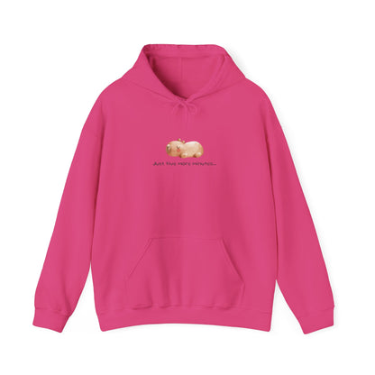 Just Five More Minutes...Capybara Unisex Hooded Sweatshirt is made for the ultimate snoozer! Featuring a relaxed capybara graphic, this cozy hoodie perfectly captures those lazy mornings when you just need a little more time. Soft, warm, and perfect for everyday wear, it’s the ideal companion for staying comfy and showing off your love for capybaras and chill vibes!