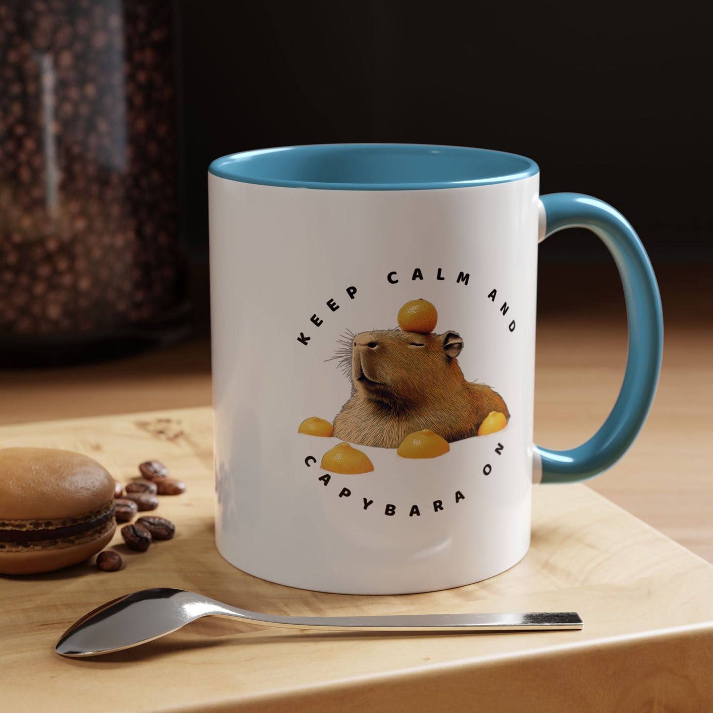 Keep Calm and Capybara On Mug. Featuring a leisurely capybara, this mug is the perfect addition to your coffee or tea routine. Ideal for animal enthusiasts and those looking for a touch of humor in their morning beverage. An excellent gift for Christmas, birthdays, or any special occasion, this mug is made of white ceramic, with a choice of 5 colorful interiors and handles. It also boasts a c-shaped handle, glossy finish, and eye-catching color contrast, while being 