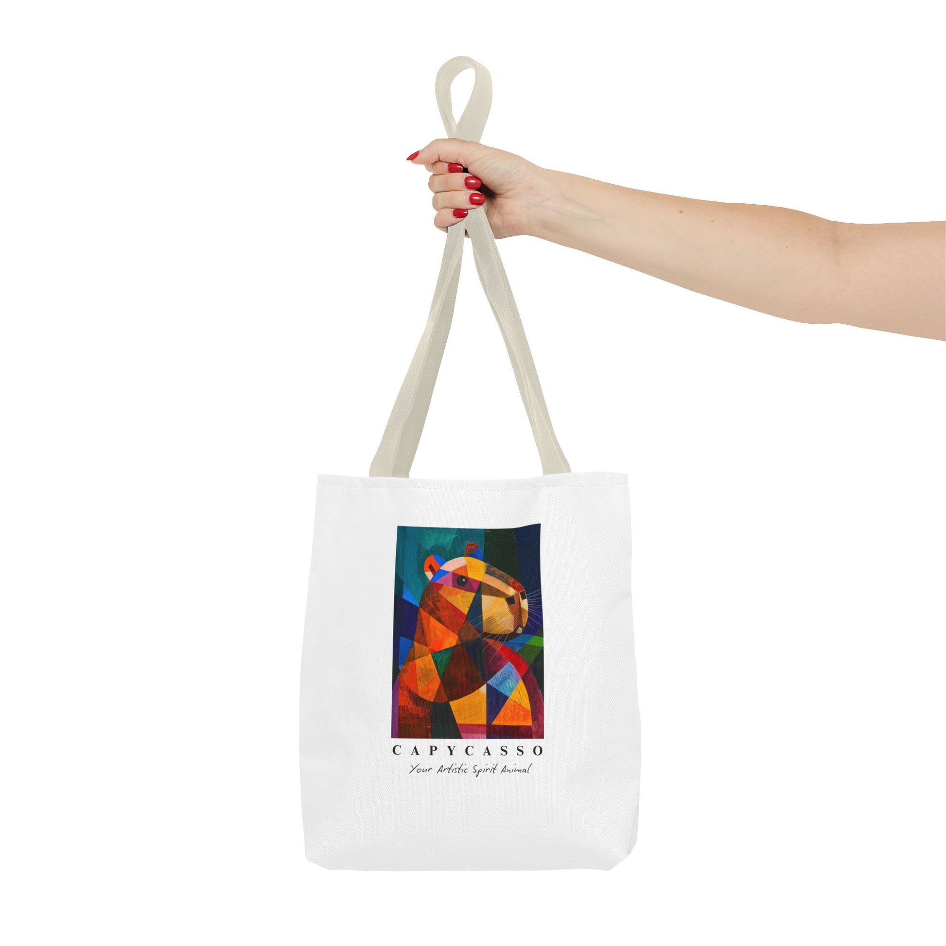 Capybara tote bag featuring a painting inspired by Pablo Picasso, with abstract forms and geometric shapes. 5 handle colours. Perfect for art lovers and capybara enthusiasts, this tote bag adds a touch of artistic flair to your everyday errands. Great for carrying books, groceries, or daily essentials. Ideal for art enthusiasts, animal lovers, and those looking to add a pop of creativity to their style. Perfect for gifting on birthdays, holidays, or as a treat for yourself.