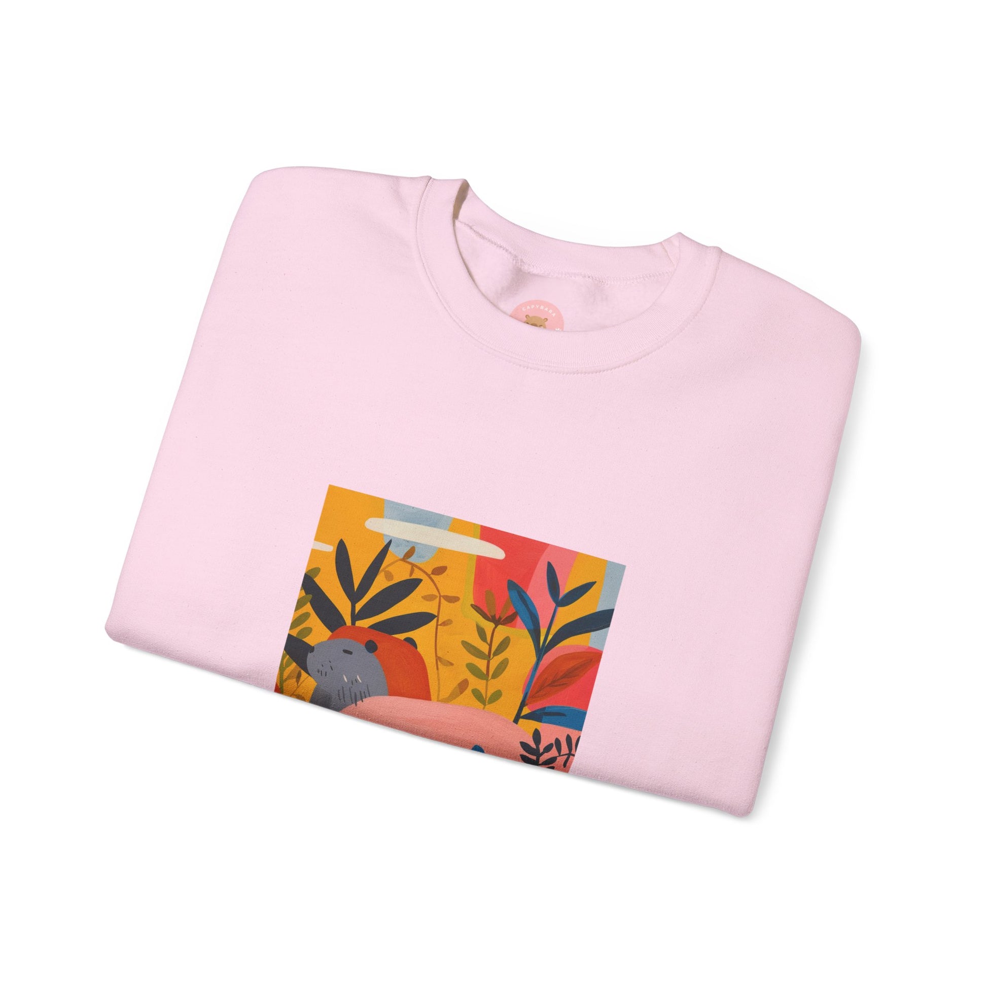 pink Capybara sweatshirt features a painting inspired by Henri Matisse with a funny twist, perfect for capybara lovers and art enthusiasts. It offers a cozy and comfortable fit, making it ideal for colder months. The medium-heavy fabric blend of cotton and polyester ensures durability and warmth. Great for snuggling up at home or showcasing your unique style.
