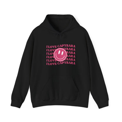 I Love Capybara hooded sweatshirt. This hoodies has a smiley face and is perfect for those who love calm vibes. Soft and comfy, it's an ideal choice for capybara lovers looking for a peaceful, stylish addition to their wardrobe.