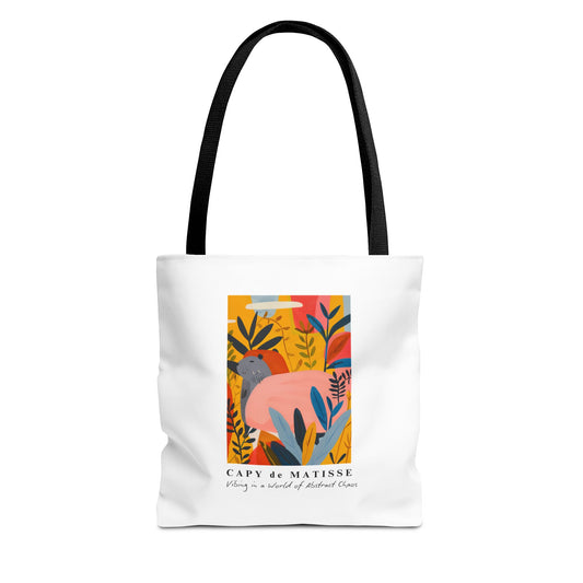 Capybara tote bag featuring a graphic of a painting inspired by artist Henri Matisse. Perfect for art lovers and capybara enthusiasts, this tote bag adds a touch of artistic flair to your everyday errands. Great for carrying books, groceries, or daily essentials. Ideal for art enthusiasts, animal lovers, and those looking to add a pop of creativity to their style. Perfect for gifting on birthdays, holidays, or as a treat for yourself.