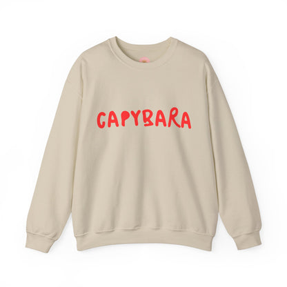 Capybara crewneck sweatshirt features the playful plain text design of CAPYBARA. It offers a comfy wearing experience with a classic fit and crew neckline. Perfect for colder months, this sweatshirt is ideal for those who love unique and chill designs. The target audience includes individuals who enjoy cozy apparel with a touch of personality. Relevant for holidays, casual gatherings, and everyday wear.