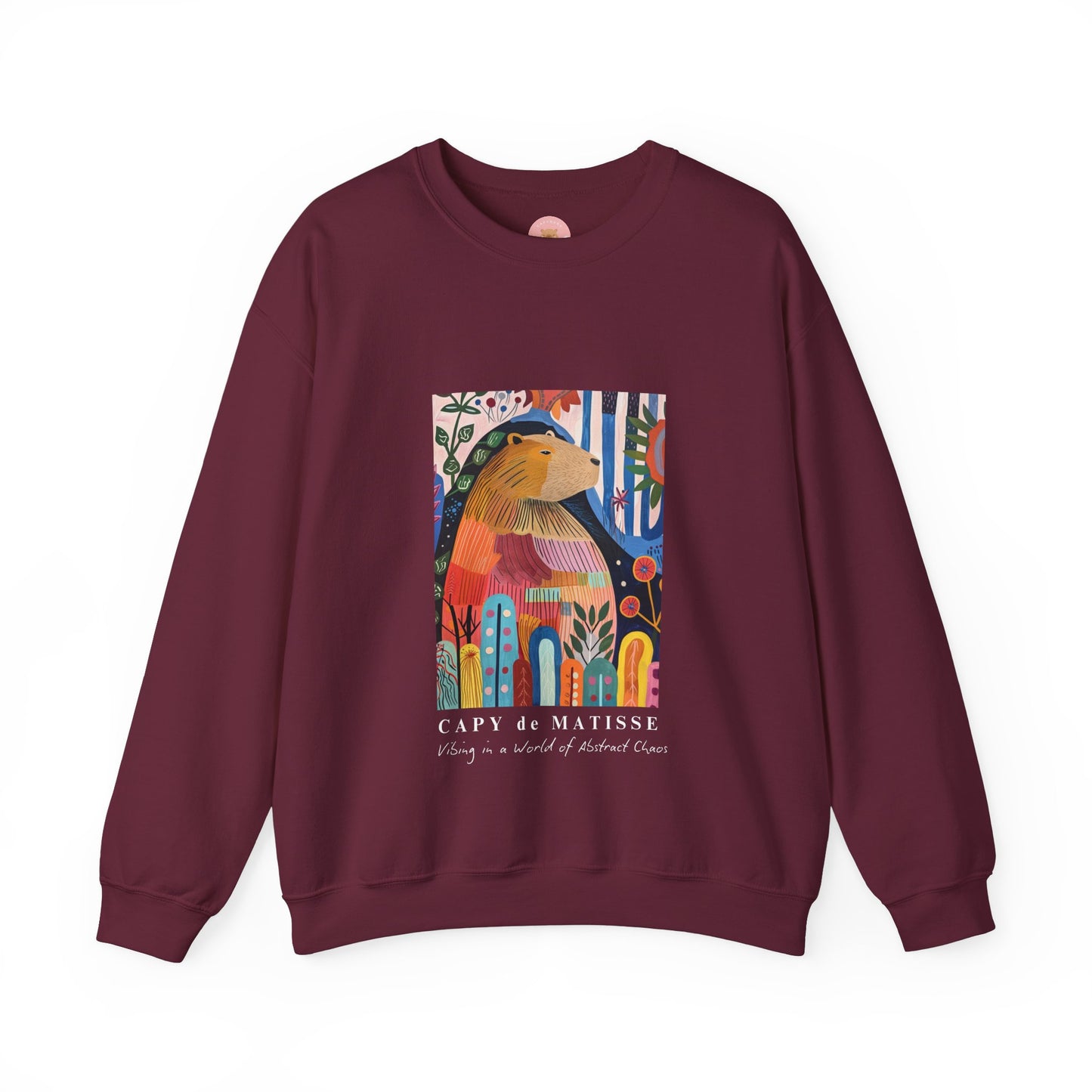 A cozy and stylish sweatshirt featuring a graphic of a painting inspired by artist Henri Matisse, with a capybara hidden within. Perfect for art lovers and capybara enthusiasts, this sweatshirt is ideal for colder months and provides a comfy fit with its classic crew neckline. Great for anyone looking to add a touch of artistic flair to their wardrobe.
