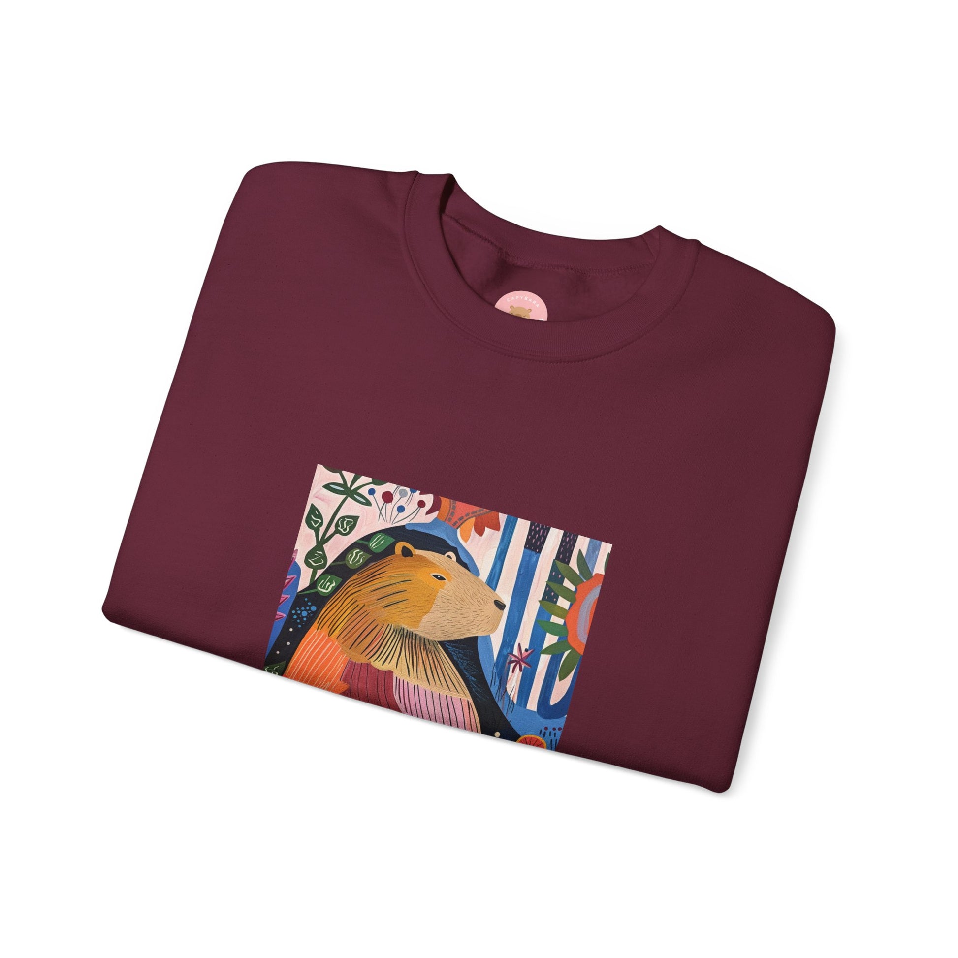 A cozy and stylish sweatshirt featuring a graphic of a painting inspired by artist Henri Matisse, with a capybara hidden within. Perfect for art lovers and capybara enthusiasts, this sweatshirt is ideal for colder months and provides a comfy fit with its classic crew neckline. Great for anyone looking to add a touch of artistic flair to their wardrobe.

