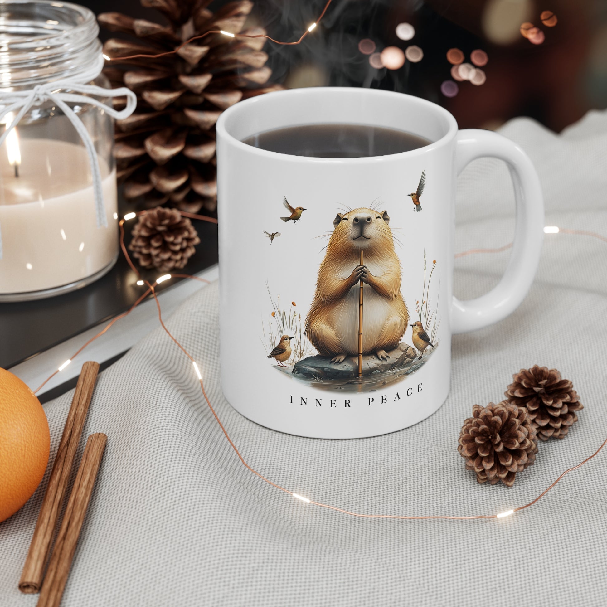 Inner Peace Capybara Mug. Featuring a serene capybara and the words "Inner Peace," this mug is perfect for moments of mindfulness and relaxation. Sip your favorite beverage and embrace tranquility with every sip.