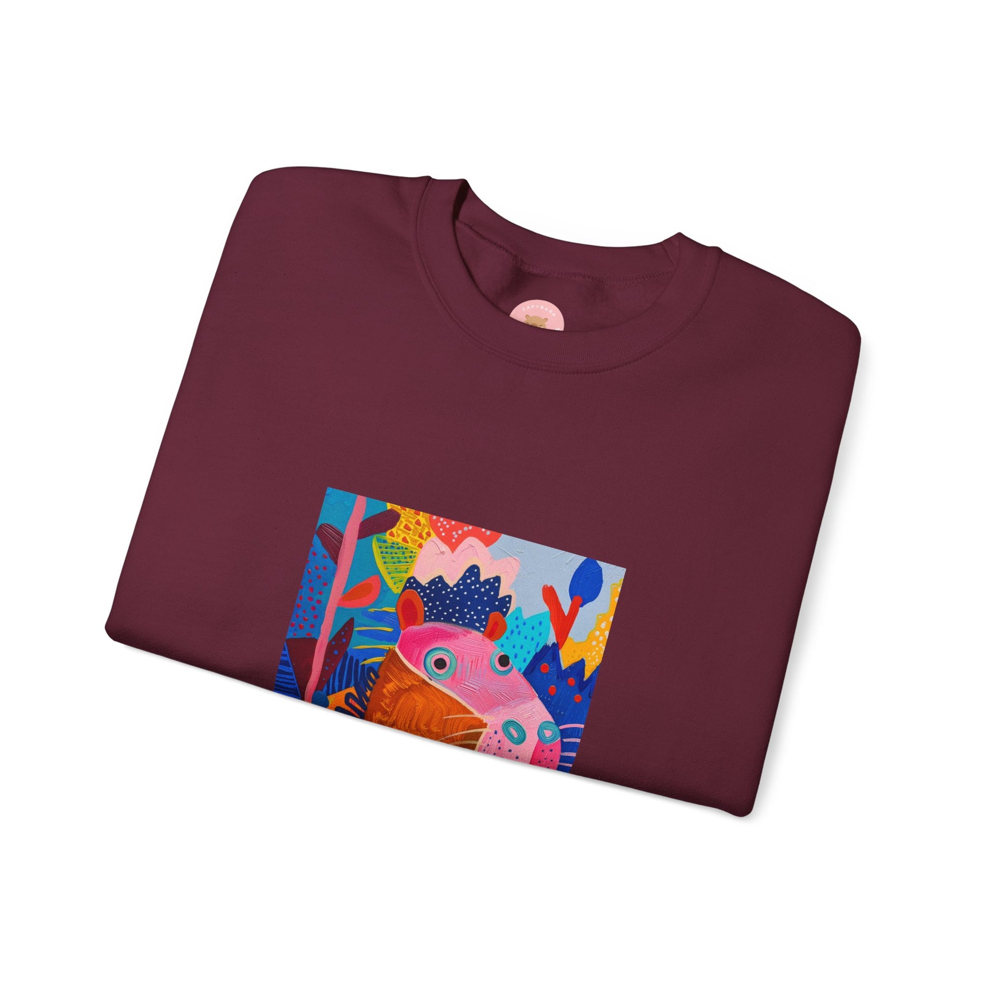 Marron Capybara sweatshirt features a painting inspired by Henri Matisse with a silly capybara embedded inside, perfect for capybara lovers and art enthusiasts. It offers a cozy and comfortable fit, making it ideal for colder months. The medium-heavy fabric blend of cotton and polyester ensures durability and warmth. Great for snuggling up at home or showcasing your unique style.