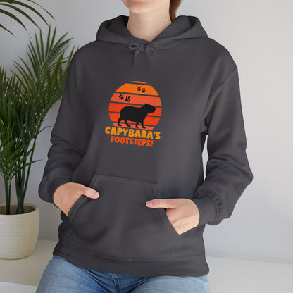 Capybara Footsteps hooded sweatshirt. This hoodies is perfect for those who love for animal lovers and those who appreciate a whimsical touh in their wardrobe.