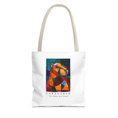 Capybara tote bag featuring a painting inspired by Pablo Picasso, with abstract forms and geometric shapes. 5 handle colours. Perfect for art lovers and capybara enthusiasts, this tote bag adds a touch of artistic flair to your everyday errands. Great for carrying books, groceries, or daily essentials. Ideal for art enthusiasts, animal lovers, and those looking to add a pop of creativity to their style. Perfect for gifting on birthdays, holidays, or as a treat for yourself.