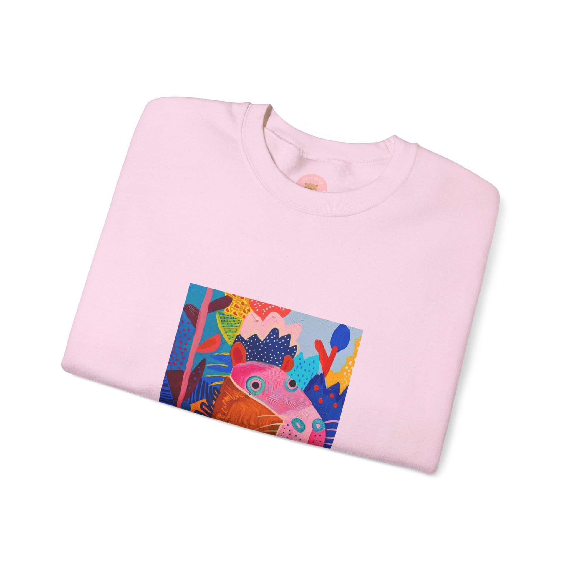 Pink Capybara sweatshirt features a painting inspired by Henri Matisse with a silly capybara embedded inside, perfect for capybara lovers and art enthusiasts. It offers a cozy and comfortable fit, making it ideal for colder months. The medium-heavy fabric blend of cotton and polyester ensures durability and warmth. Great for snuggling up at home or showcasing your unique style.