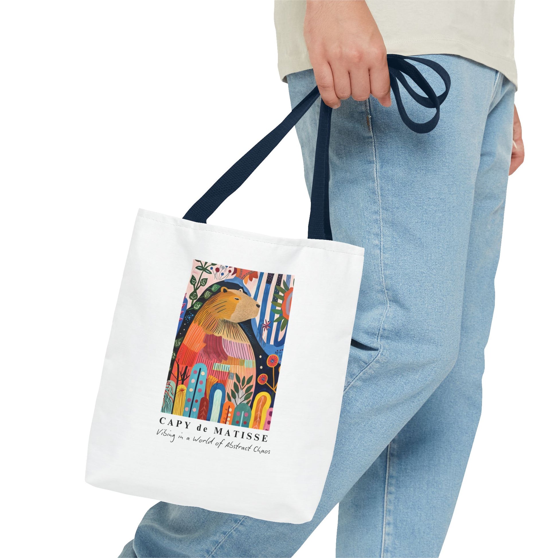 Capybara 13"x13" tote bag featuring a graphic of a painting inspired by artist Henri Matisse, with a hidden capybara. Perfect for art lovers and capybara enthusiasts, this tote bag adds a touch of artistic flair to your everyday errands. Great for carrying books, groceries, or daily essentials. Ideal for art enthusiasts, animal lovers, and those looking to add a pop of creativity to their style. Perfect for gifting on birthdays, holidays, or as a treat for yourself.