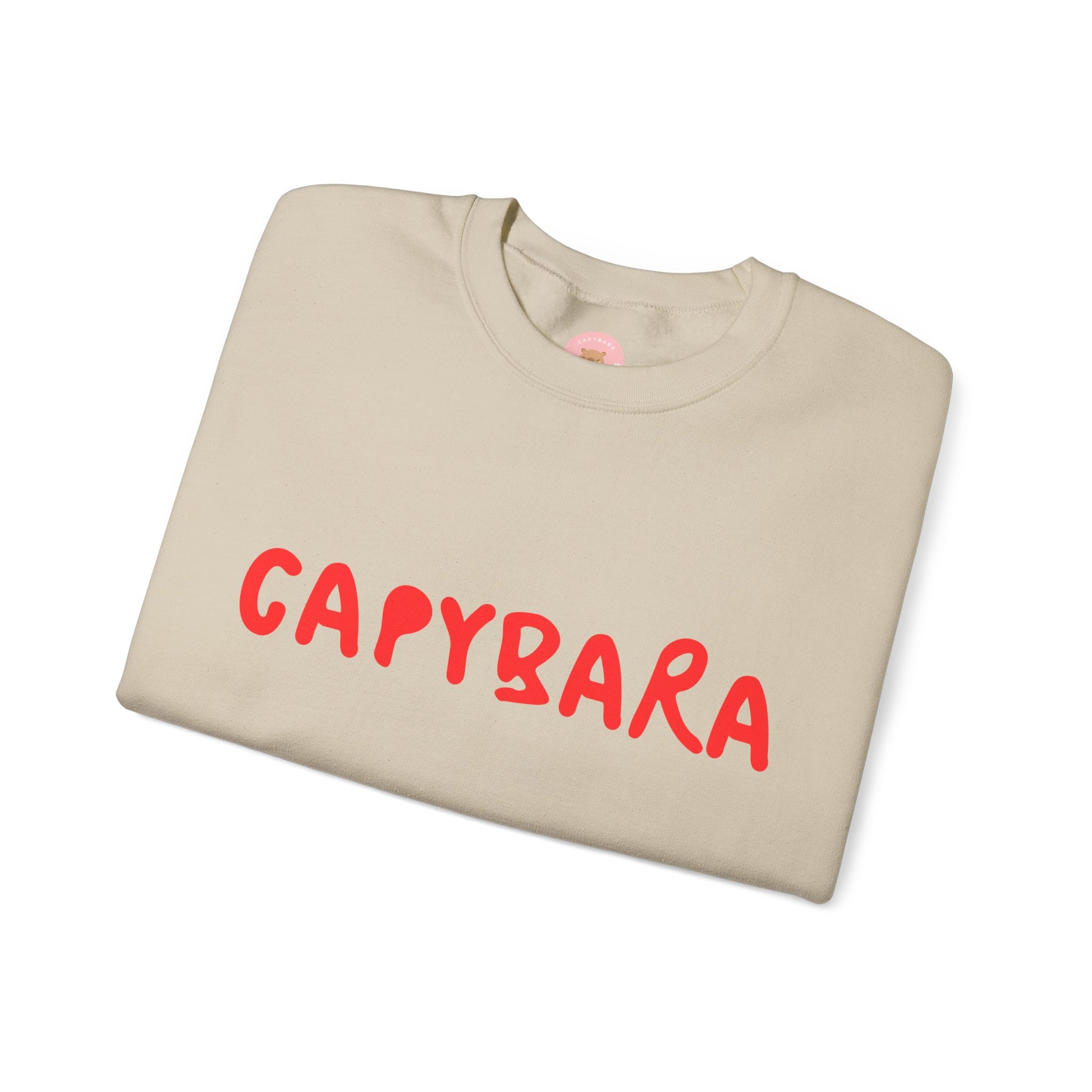 Capybara crewneck sweatshirt features the playful plain text design of CAPYBARA. It offers a comfy wearing experience with a classic fit and crew neckline. Perfect for colder months, this sweatshirt is ideal for those who love unique and chill designs. The target audience includes individuals who enjoy cozy apparel with a touch of personality. Relevant for holidays, casual gatherings, and everyday wear.