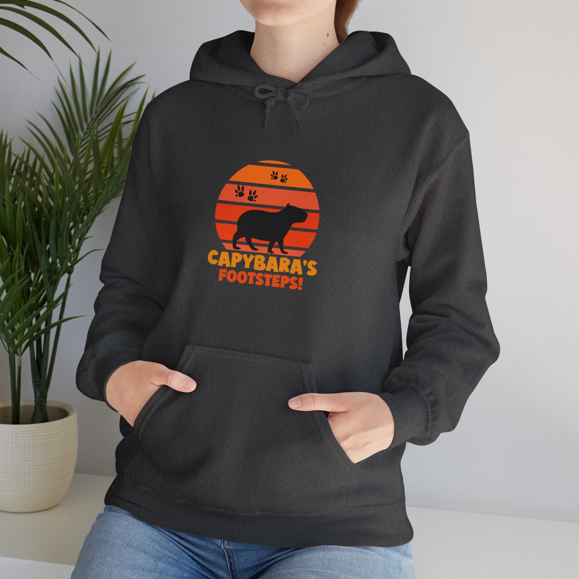Capybara Footsteps hooded sweatshirt. This hoodies is perfect for those who love for animal lovers and those who appreciate a whimsical touh in their wardrobe.