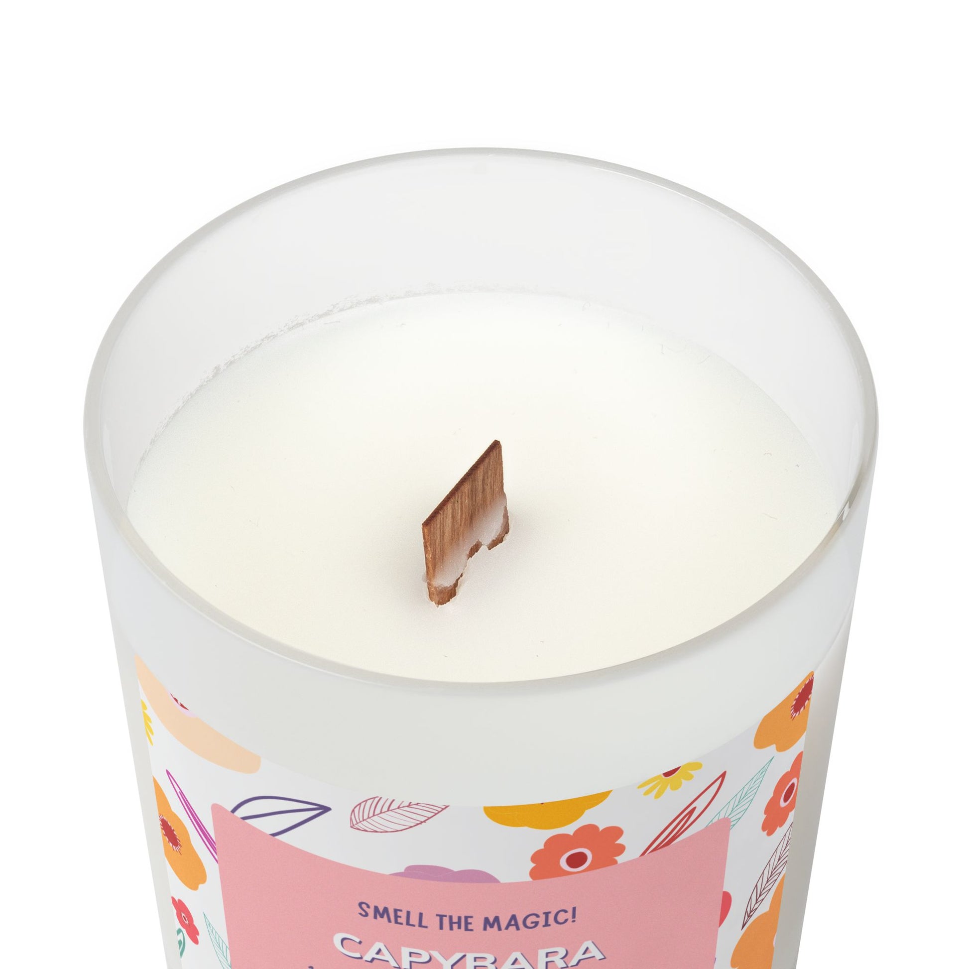 Capybara Gift 11oz Frost Candle, featuring a funny label featuring a cute capybara and a flowery background. It has an unique wooden wick that crackles gently as it burns. This exquisite candle is more than just a light source—it's an elegant piece of decor