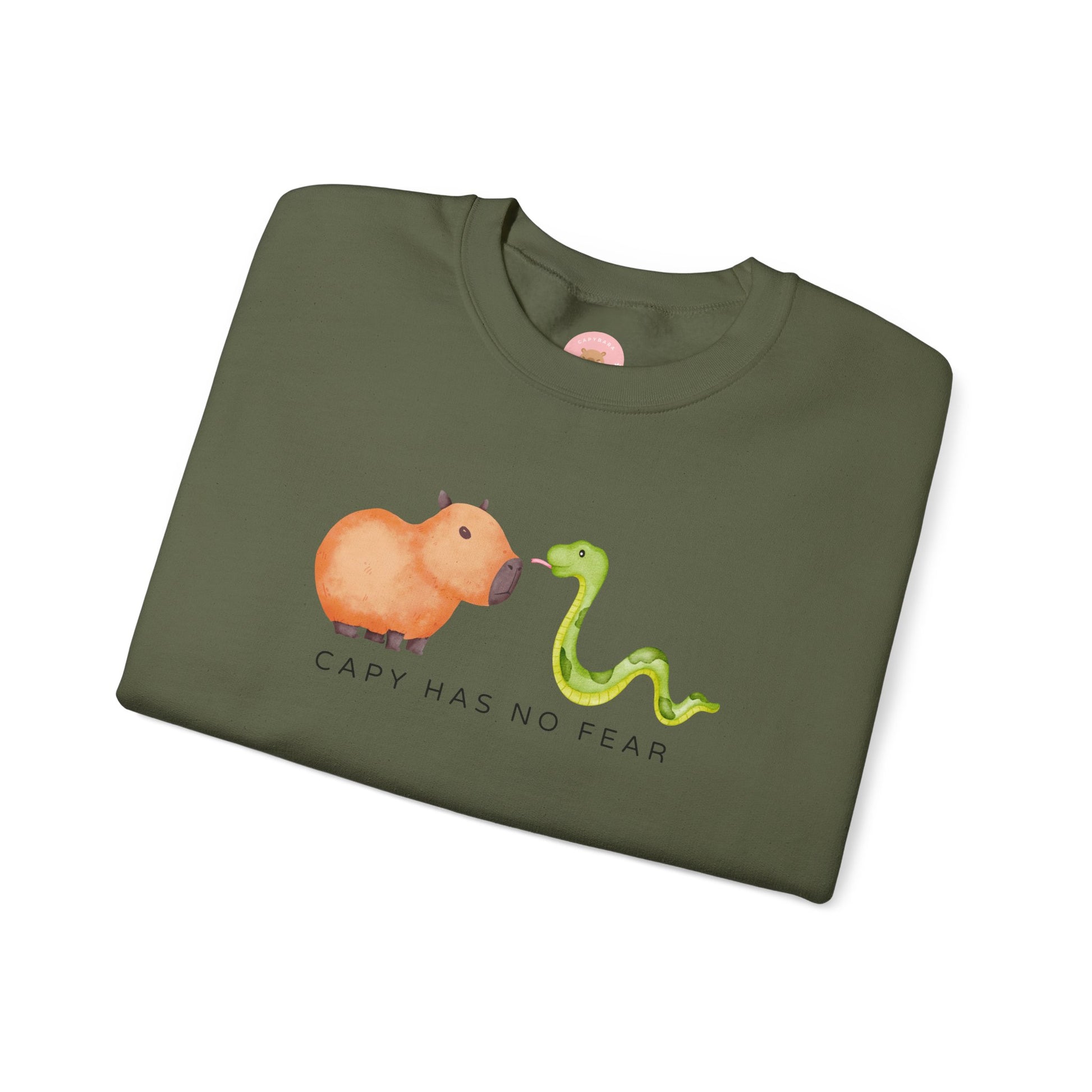 CNY Capybara clothes, Year of the Snake in style with our 'Capy has no fear' Crewneck Sweatshirt! Featuring a bold graphic of a fearless capybara facing a snake, this design is a humorous and symbolic nod to the Chinese New Year. Show off your courage and charm while staying cozy—perfect for family gatherings and festive celebrations!