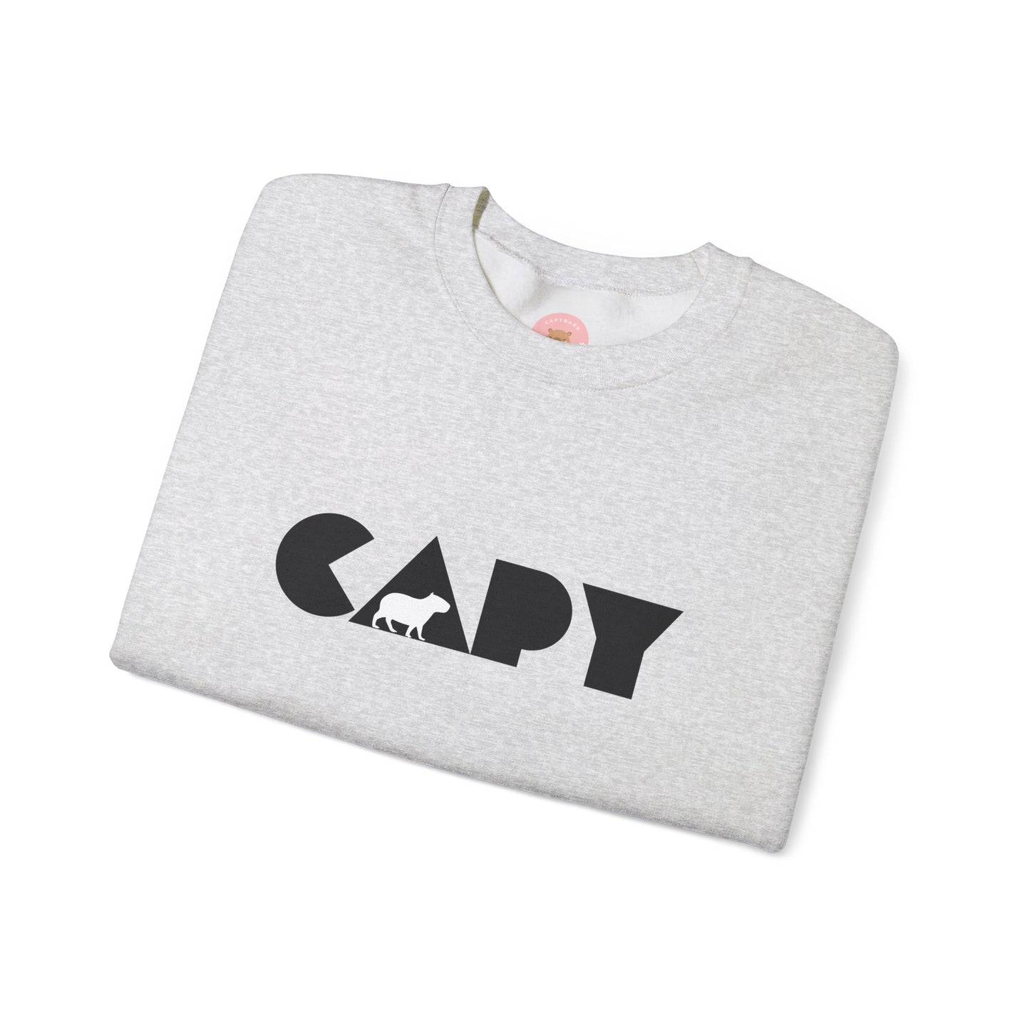 Capybara sweatshirt features the stylish plain text design of the word CAPY with a capybara graphic embedded. It offers a comfy wearing experience with a classic fit and crew neckline. Perfect for colder months, this sweatshirt is ideal for those who love unique and chill designs. The target audience includes individuals who enjoy cozy apparel with a touch of personality. Relevant for holidays, casual gatherings, and everyday wear.