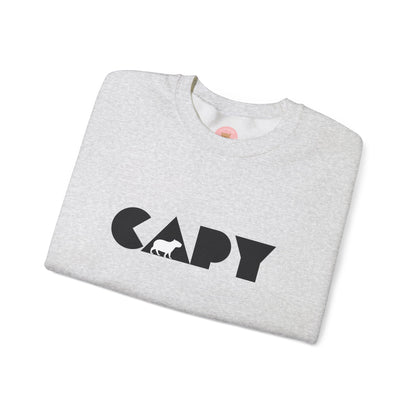 Capybara sweatshirt features the stylish plain text design of the word CAPY with a capybara graphic embedded. It offers a comfy wearing experience with a classic fit and crew neckline. Perfect for colder months, this sweatshirt is ideal for those who love unique and chill designs. The target audience includes individuals who enjoy cozy apparel with a touch of personality. Relevant for holidays, casual gatherings, and everyday wear.
