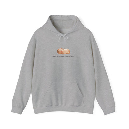 Just Five More Minutes...Capybara Unisex Hooded Sweatshirt is made for the ultimate snoozer! Featuring a relaxed capybara graphic, this cozy hoodie perfectly captures those lazy mornings when you just need a little more time. Soft, warm, and perfect for everyday wear, it’s the ideal companion for staying comfy and showing off your love for capybaras and chill vibes!