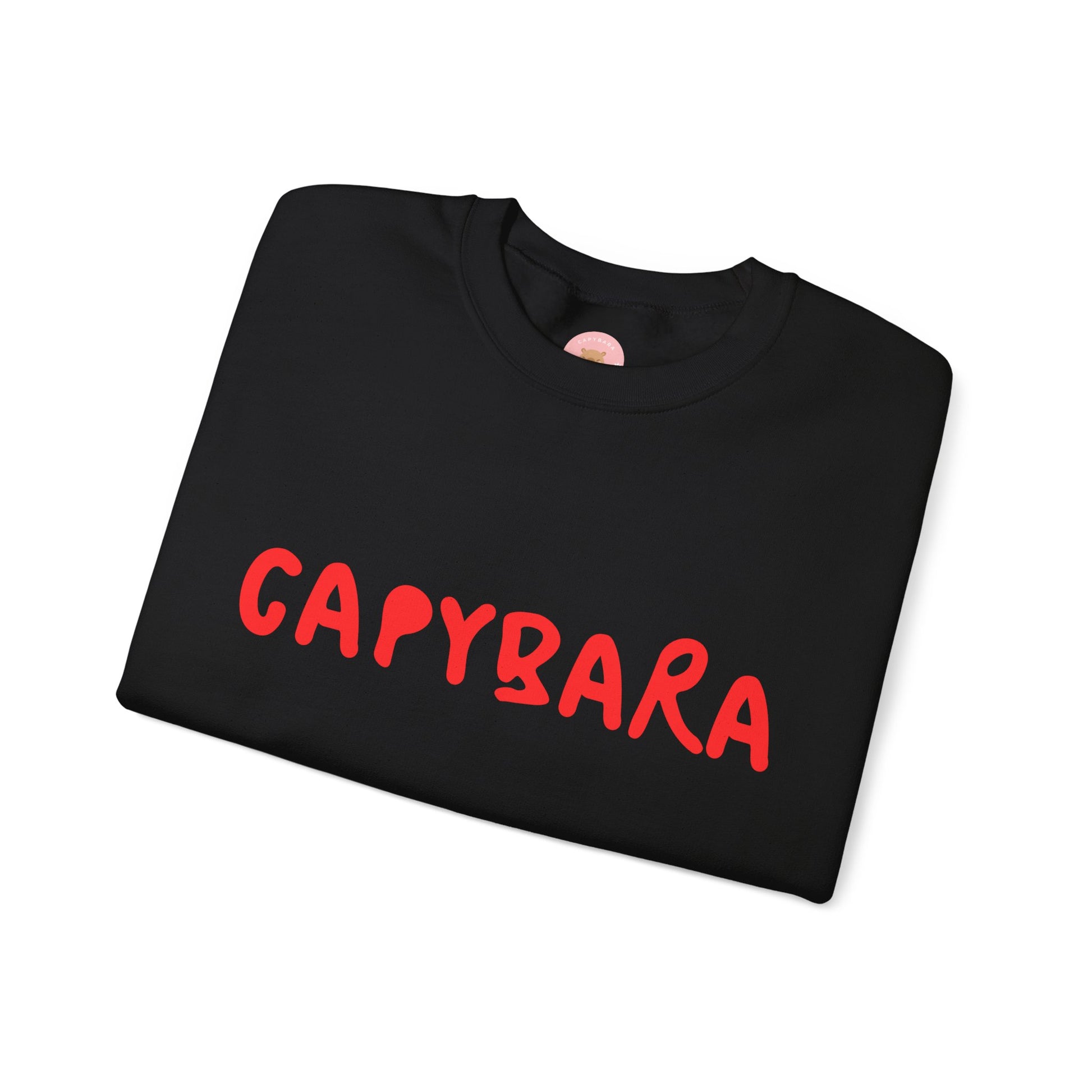Capybara crewneck sweatshirt features the playful plain text design of CAPYBARA. It offers a comfy wearing experience with a classic fit and crew neckline. Perfect for colder months, this sweatshirt is ideal for those who love unique and chill designs. The target audience includes individuals who enjoy cozy apparel with a touch of personality. Relevant for holidays, casual gatherings, and everyday wear.