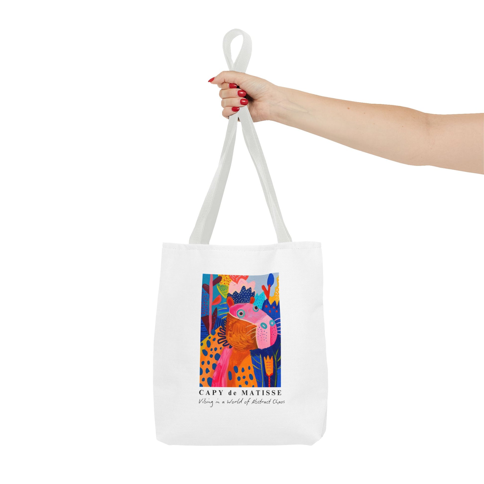 Capybara tote bag featuring a graphic of a painting inspired by artist Henri Matisse, with a hidden capybara. Perfect for art lovers and capybara enthusiasts, this tote bag adds a touch of artistic flair to your everyday errands. Great for carrying books, groceries, or daily essentials. Ideal for art enthusiasts, animal lovers, and those looking to add a pop of creativity to their style. Perfect for gifting on birthdays, holidays, or as a treat for yourself.