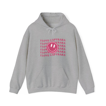 I Love Capybara hooded sweatshirt. This hoodies has a smiley face and is perfect for those who love calm vibes. Soft and comfy, it's an ideal choice for capybara lovers looking for a peaceful, stylish addition to their wardrobe.