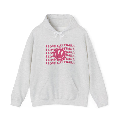 I Love Capybara hooded sweatshirt. This hoodies has a smiley face and is perfect for those who love calm vibes. Soft and comfy, it's an ideal choice for capybara lovers looking for a peaceful, stylish addition to their wardrobe.