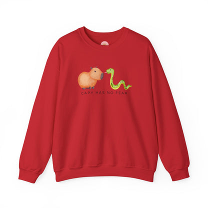 CNY Capybara clothes, Year of the Snake in style with our 'Capy has no fear' Crewneck Sweatshirt! Featuring a bold graphic of a fearless capybara facing a snake, this design is a humorous and symbolic nod to the Chinese New Year. Show off your courage and charm while staying cozy—perfect for family gatherings and festive celebrations!