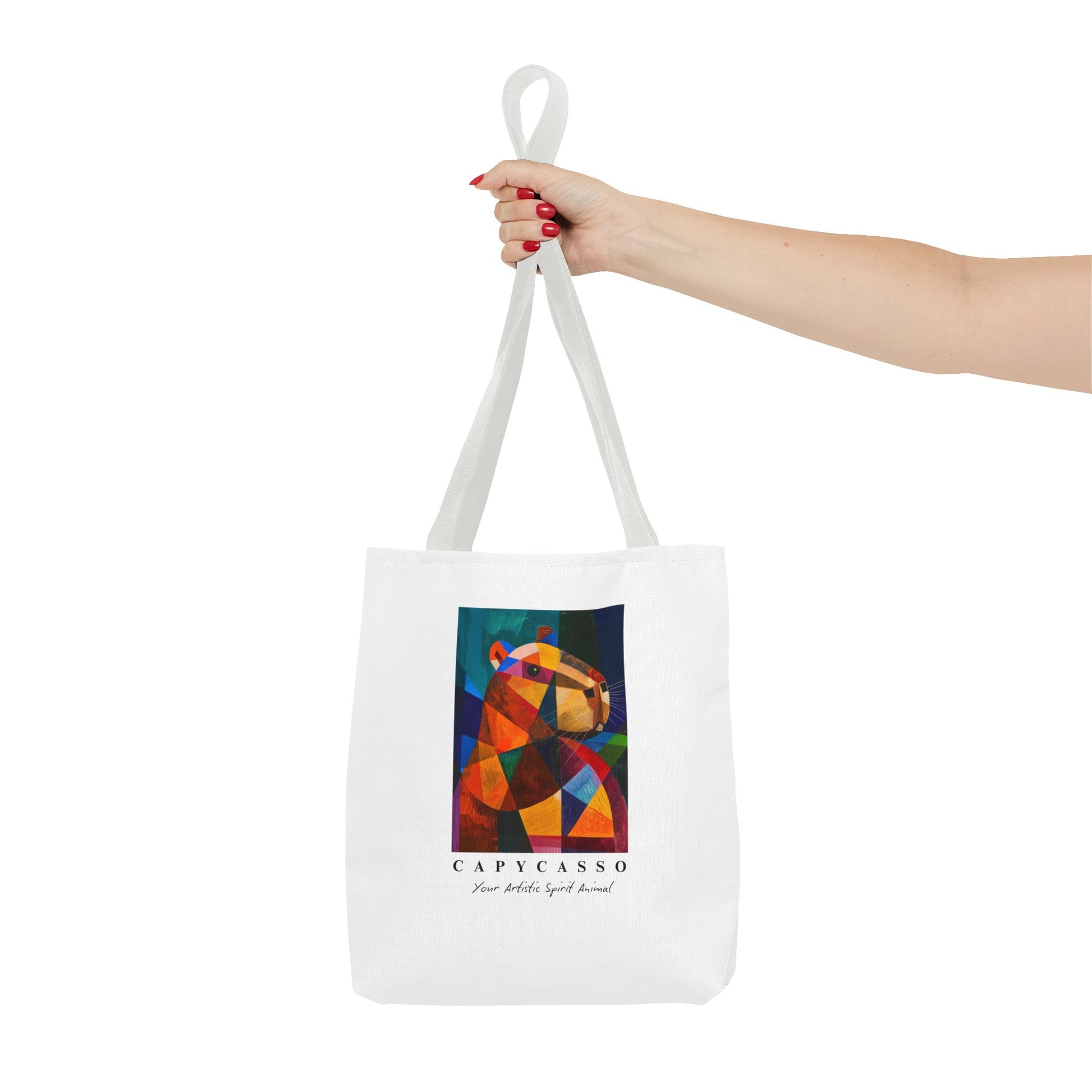 Capybara tote bag featuring a painting inspired by Pablo Picasso, with abstract forms and geometric shapes. 5 handle colours. Perfect for art lovers and capybara enthusiasts, this tote bag adds a touch of artistic flair to your everyday errands. Great for carrying books, groceries, or daily essentials. Ideal for art enthusiasts, animal lovers, and those looking to add a pop of creativity to their style. Perfect for gifting on birthdays, holidays, or as a treat for yourself.