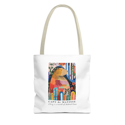 Capybara 13"x13" tote bag featuring a graphic of a painting inspired by artist Henri Matisse, with a hidden capybara. Perfect for art lovers and capybara enthusiasts, this tote bag adds a touch of artistic flair to your everyday errands. Great for carrying books, groceries, or daily essentials. Ideal for art enthusiasts, animal lovers, and those looking to add a pop of creativity to their style. Perfect for gifting on birthdays, holidays, or as a treat for yourself.