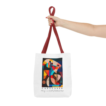 Capybara tote bag featuring a painting inspired by Pablo Picasso, with abstract forms and geometric shapes. 5 handle colours. Perfect for art lovers and capybara enthusiasts, this tote bag adds a touch of artistic flair to your everyday errands. Great for carrying books, groceries, or daily essentials. Ideal for art enthusiasts, animal lovers, and those looking to add a pop of creativity to their style. Perfect for gifting on birthdays, holidays, or as a treat for yourself.