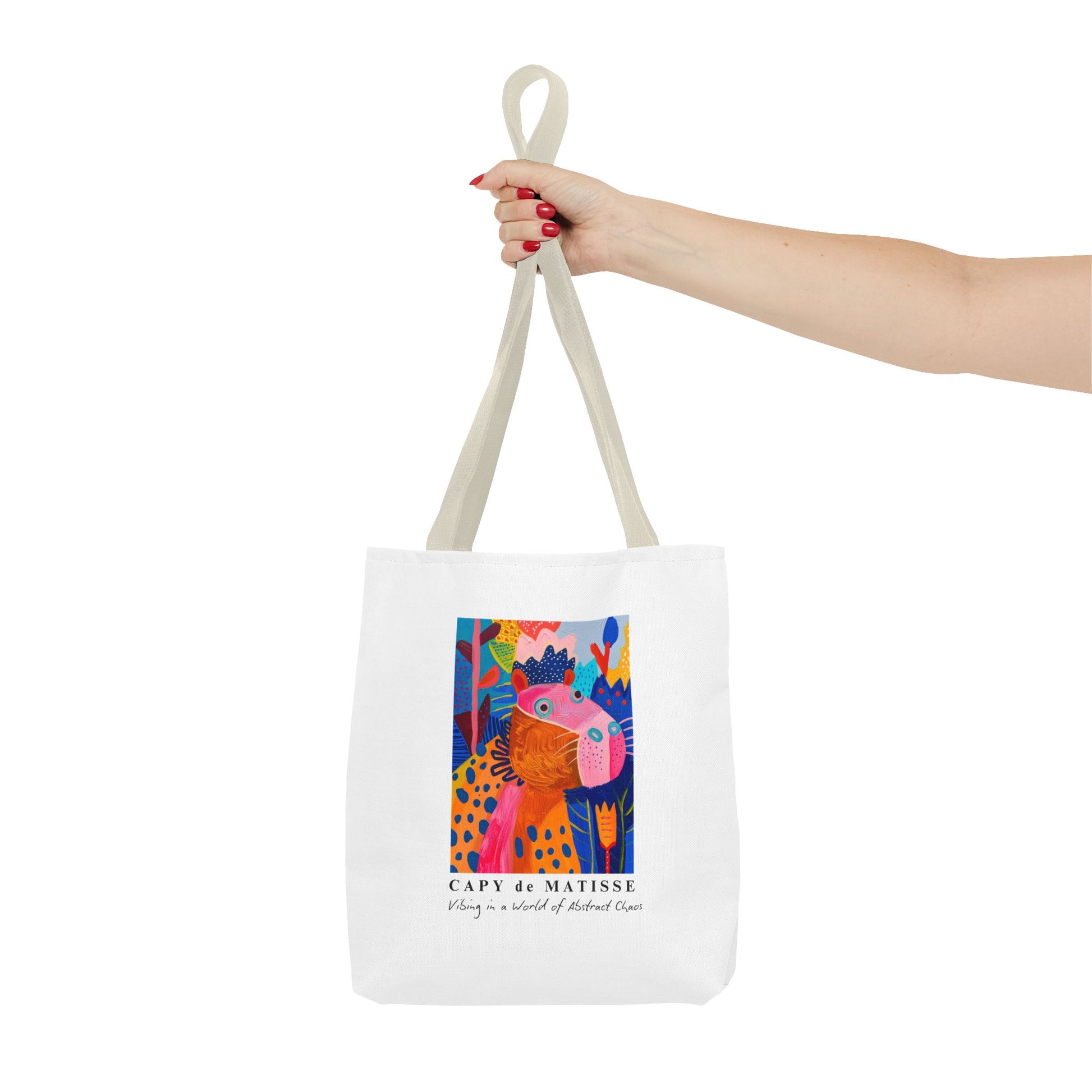 Capybara tote bag featuring a graphic of a painting inspired by artist Henri Matisse, with a hidden capybara. Perfect for art lovers and capybara enthusiasts, this tote bag adds a touch of artistic flair to your everyday errands. Great for carrying books, groceries, or daily essentials. Ideal for art enthusiasts, animal lovers, and those looking to add a pop of creativity to their style. Perfect for gifting on birthdays, holidays, or as a treat for yourself.