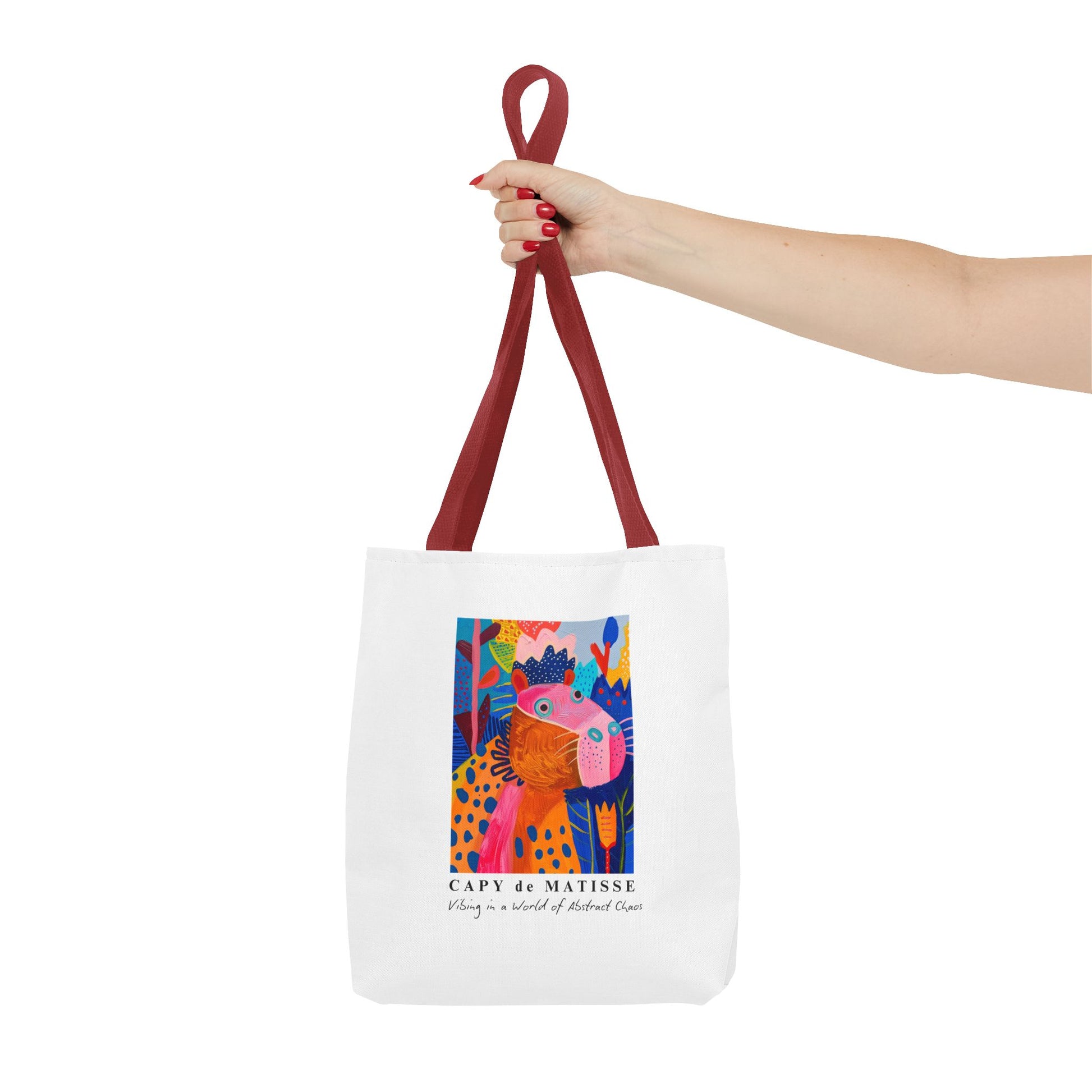 Capybara tote bag featuring a graphic of a painting inspired by artist Henri Matisse, with a hidden capybara. Perfect for art lovers and capybara enthusiasts, this tote bag adds a touch of artistic flair to your everyday errands. Great for carrying books, groceries, or daily essentials. Ideal for art enthusiasts, animal lovers, and those looking to add a pop of creativity to their style. Perfect for gifting on birthdays, holidays, or as a treat for yourself.