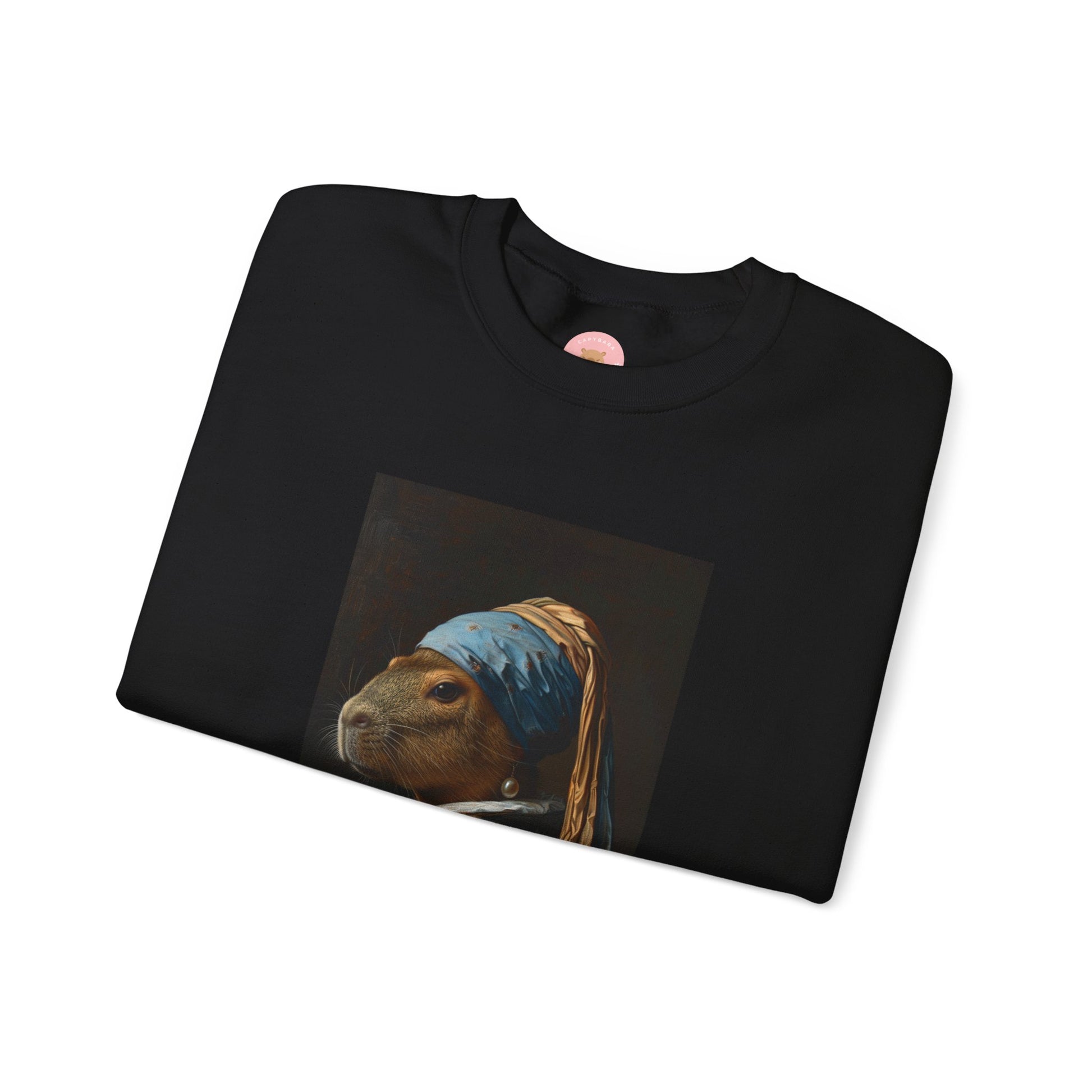 Capy de Vermeer Capybara sweatshirt features a painting inspired by VERMEER's famous painting - A Girl With A Pearl Earring. It's a fun twist for capybara lovers and art enthusiasts, giving off a whimsical and artistic vibe. Perfect for those who appreciate unique and creative designs, this sweatshirt is relevant for art lovers, animal enthusiasts, and those looking for a quirky addition to their wardrobe. Ideal for gifting during birthdays, Christmas, or any special occasion.