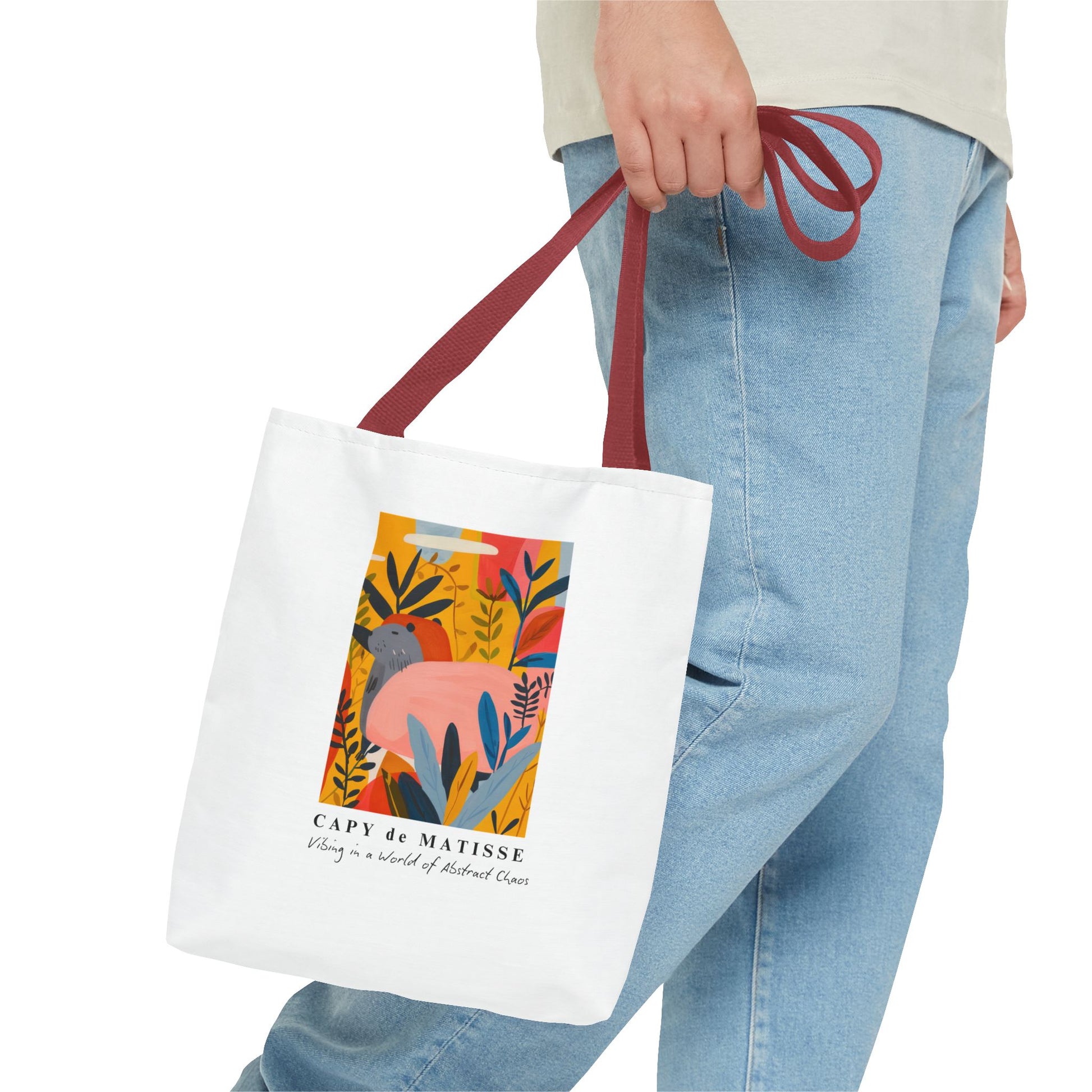 Capybara tote bag featuring a graphic of a painting inspired by artist Henri Matisse. Perfect for art lovers and capybara enthusiasts, this tote bag adds a touch of artistic flair to your everyday errands. Great for carrying books, groceries, or daily essentials. Ideal for art enthusiasts, animal lovers, and those looking to add a pop of creativity to their style. Perfect for gifting on birthdays, holidays, or as a treat for yourself.