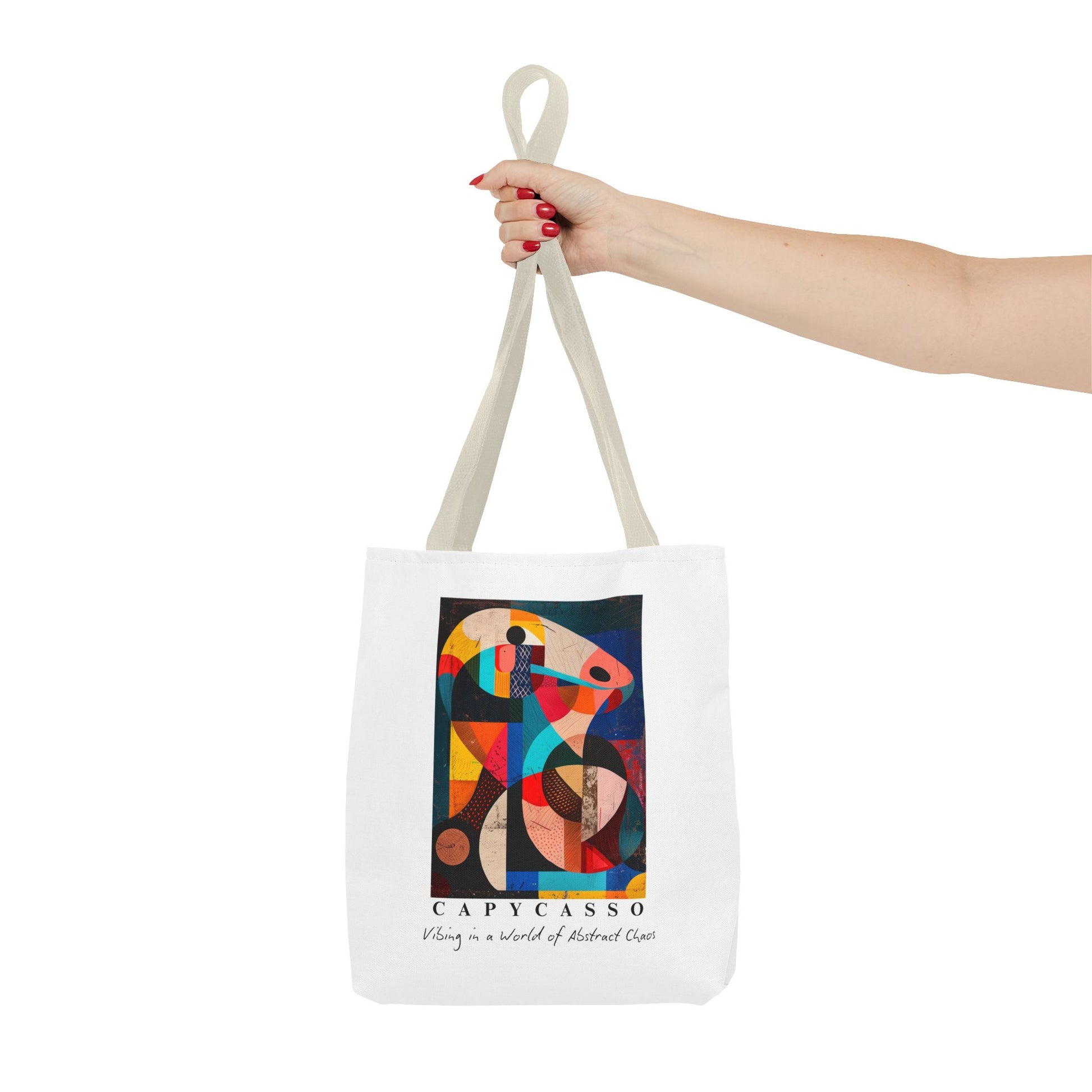 Capybara tote bag featuring a painting inspired by Pablo Picasso, with abstract forms and geometric shapes. 5 handle colours. Perfect for art lovers and capybara enthusiasts, this tote bag adds a touch of artistic flair to your everyday errands. Great for carrying books, groceries, or daily essentials. Ideal for art enthusiasts, animal lovers, and those looking to add a pop of creativity to their style. Perfect for gifting on birthdays, holidays, or as a treat for yourself.