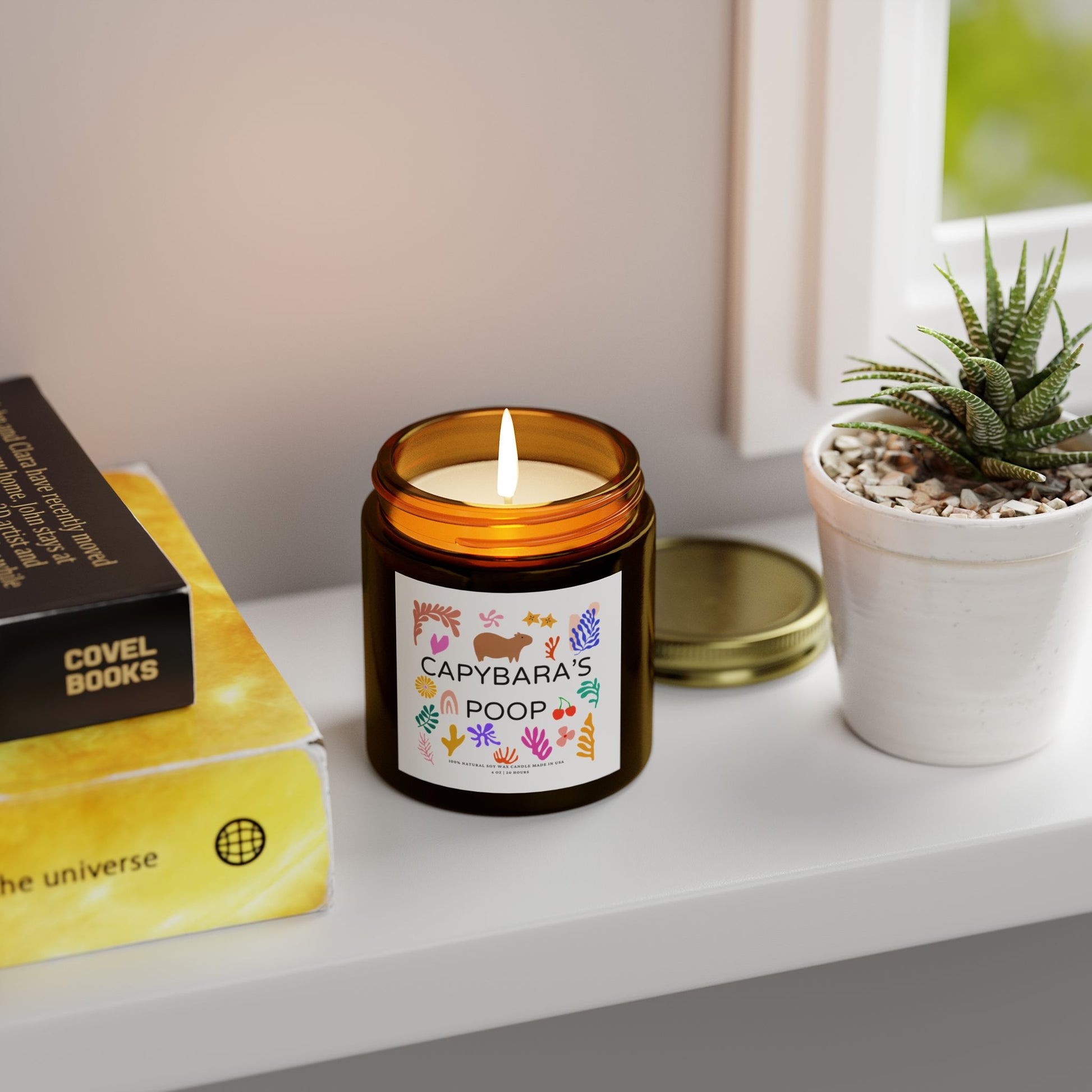 Funny candle gift with CAPYBARAS POOP label in Matisse style. Each candle is scented with Midnight Blackberry, Lavender, Fraser Fir, Cinnamon Chai, Cashmere Musk, Beachwood, Mango Coconut, and Vanilla Bean fragrances, offering up to 20 hours of burn time. Made with natural Coconut Apricot Wax in the USA, eco-friendly and non-toxic.