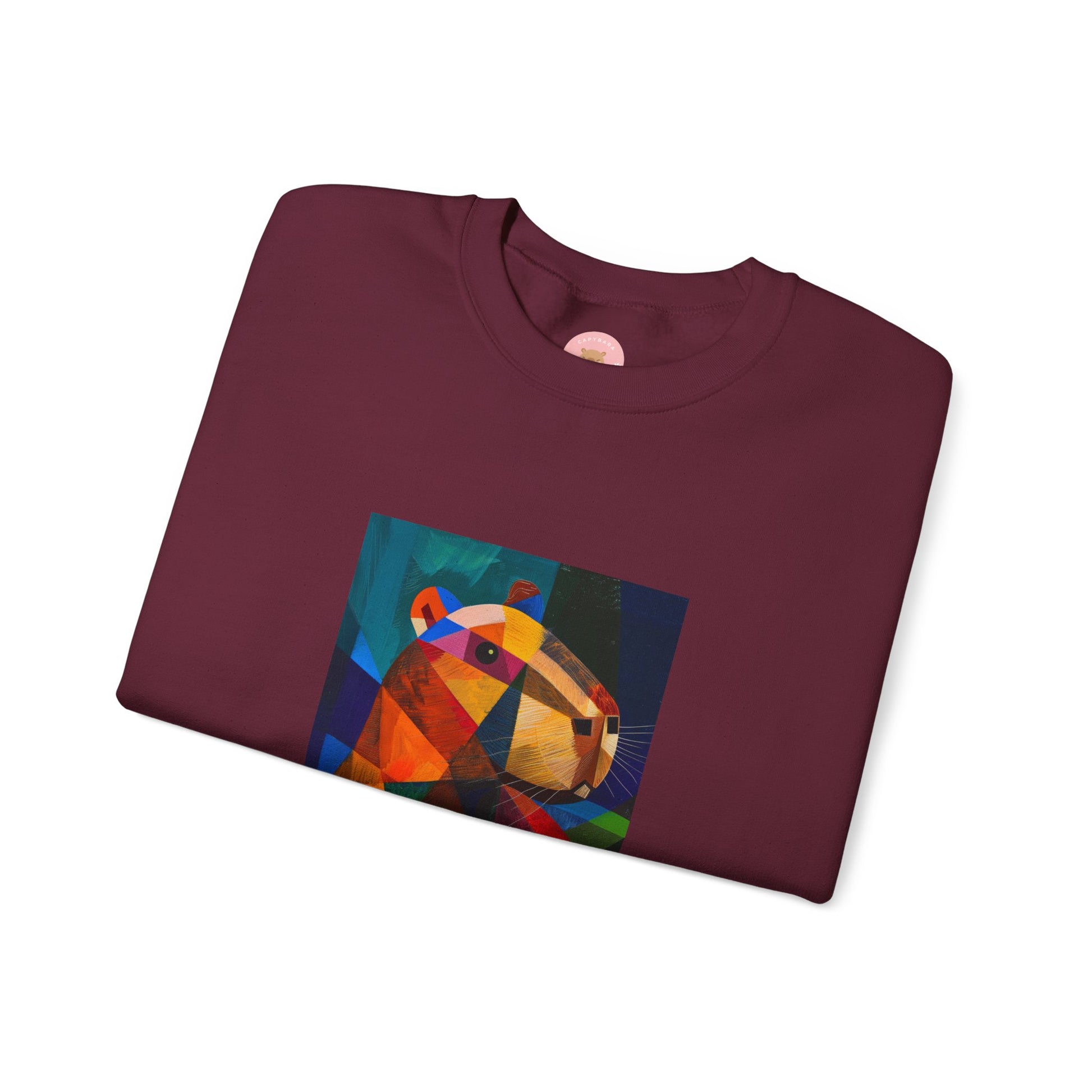 Capycasso Capybara sweatshirt features a painting inspired by Pablo Picasso, with abstract forms and geometric shapes. It adds a funny vibe and is perfect for capybara and art lovers. This cozy sweatshirt is ideal for colder months and offers a comfy wearing experience with top-tier durability.